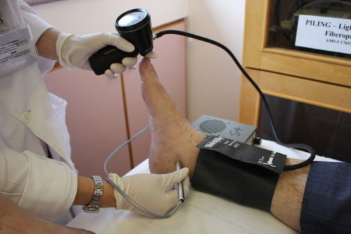 Measuring the ankle systolic pressure with a continuous-wave Doppler probe, pneumatic cuff and gauge. This reading would be compared with that at the brachial artery. Since pressure drops with increasing arterial stenosis, an ankle-brachial index of less than 0.95 would be considered abnormal.